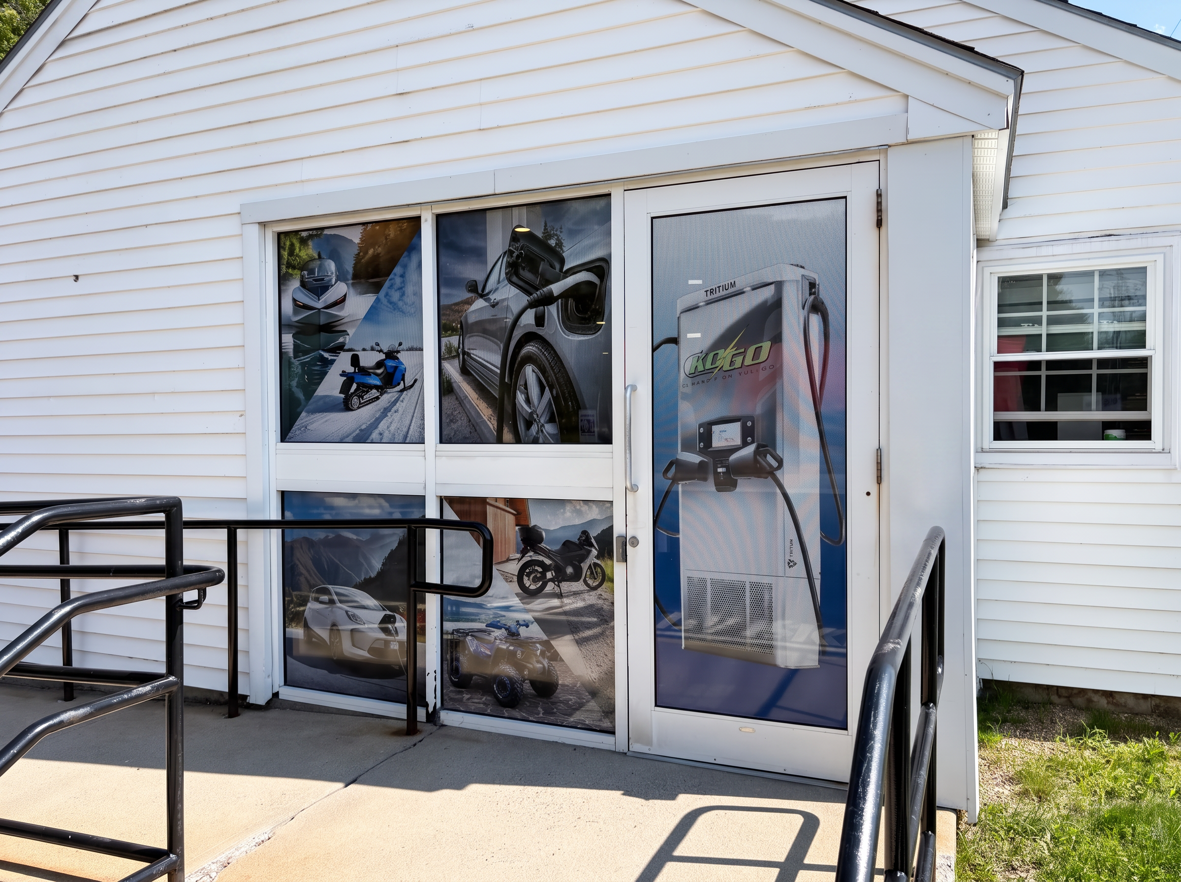 Front entrance of the KOGO e-bike shop with charging station door graphic