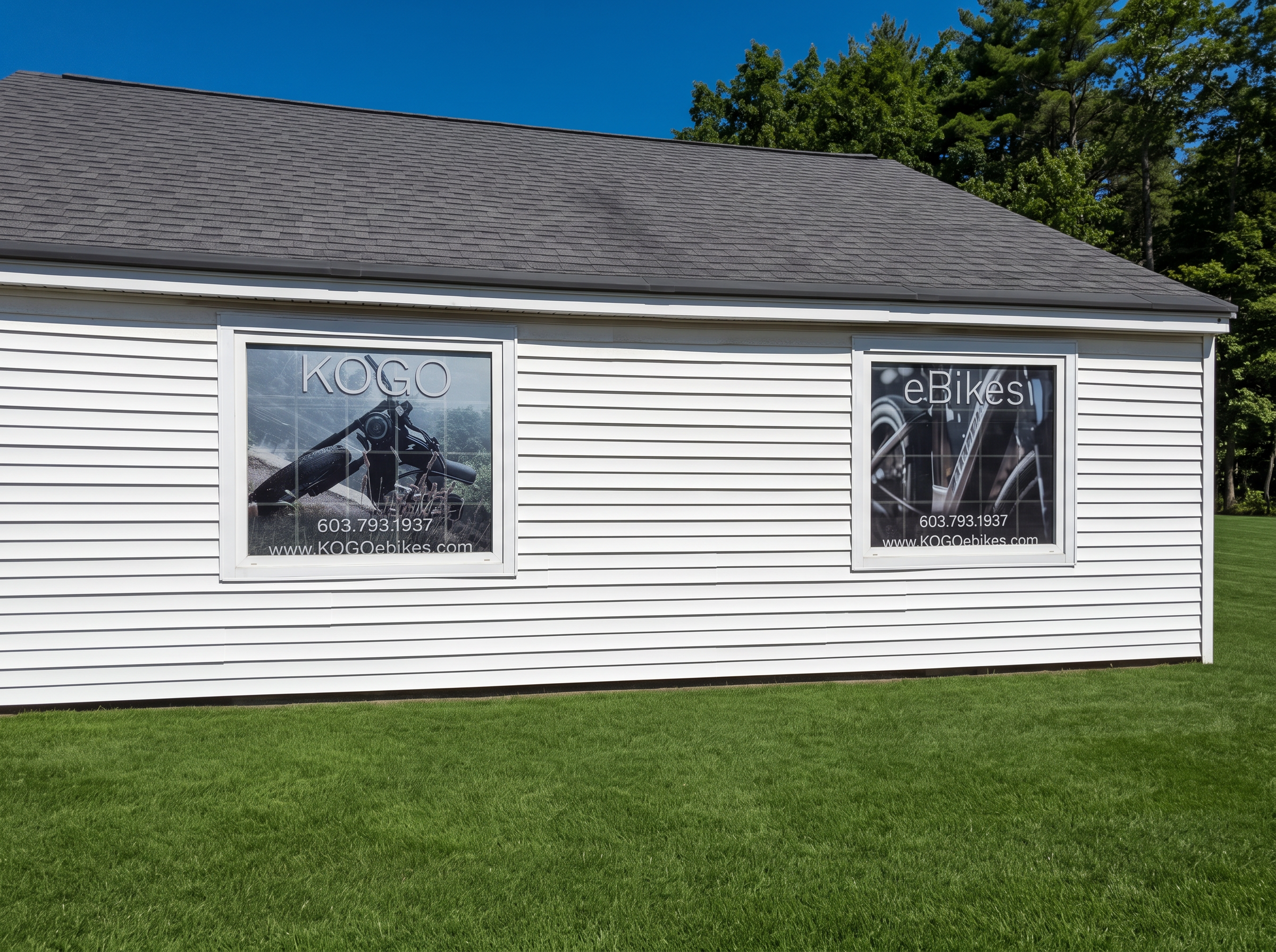 KOGO eBikes window signage on the side of the Ossipee shop